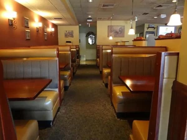 Warm wood-trimmed booths in the Manor Inn dining room